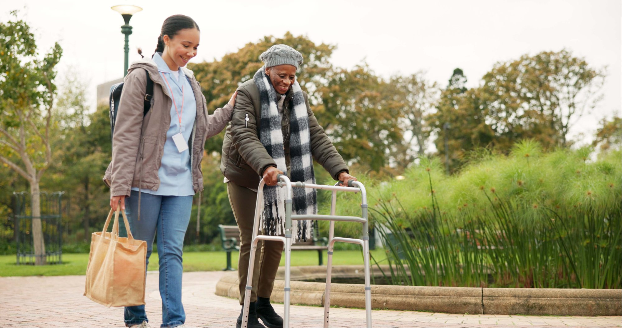 Caregiver assisting elderly woman